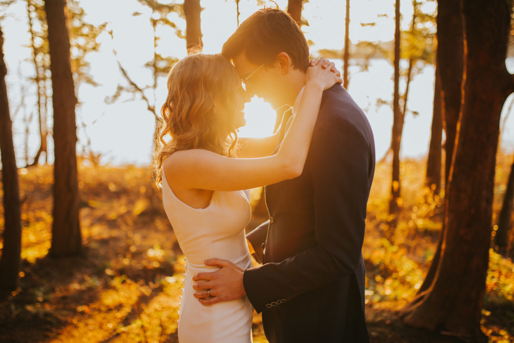 couple hugging each other during golden hour