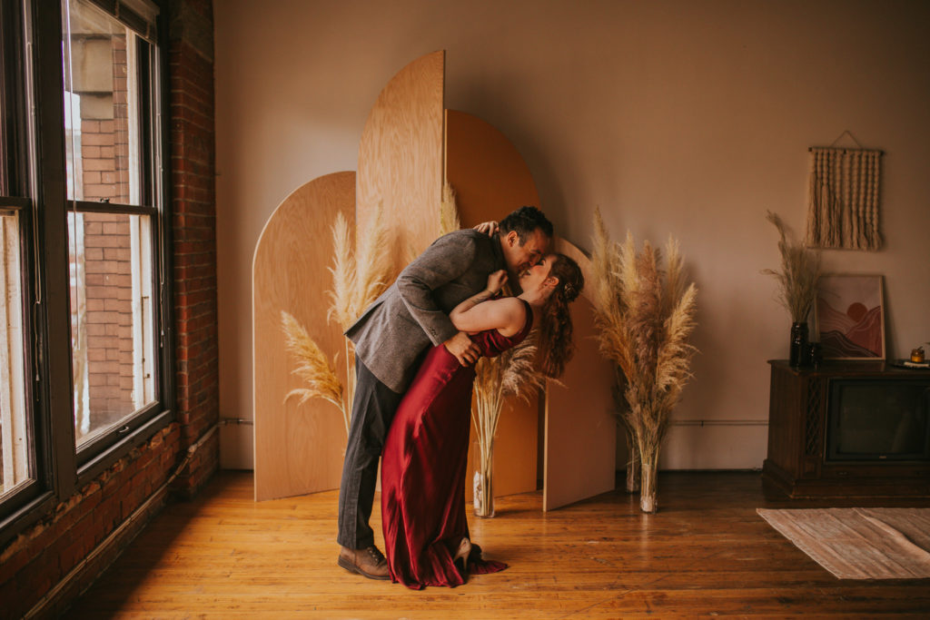 Indoor Washington State Elopement with a Red dress and grey suit